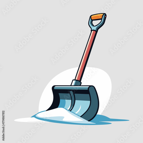 Snow shovel with snow on grey background  