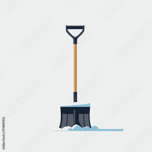 Snow shovel leaning against snow pile on neutral background  