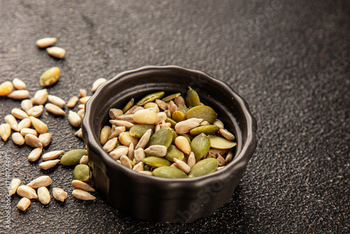 Seed mix sunflower seeds and pumpkin seeds natural product tasty snack fresh delicious gourmet food background on the table rustic top view copy space keto and paleo diet vegan and vegan food