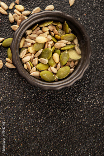 Seed mix sunflower seeds and pumpkin seeds natural product tasty snack fresh delicious gourmet food background on the table rustic top view copy space keto and paleo diet vegan and vegan food