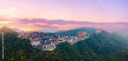 Fotografie Aerial view panorama of Ba Na hills lunar castles and French village at sunset i