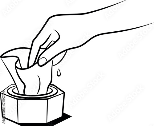 Hand pulling wet wipe from dispenser for cleaning and sanitation