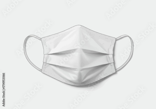 A white surgical face mask with pleats folds and ear loops casting a faint shadow on a light background
