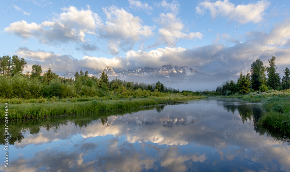 Fototapeta premium Tetons and Clouds Reflected in Water