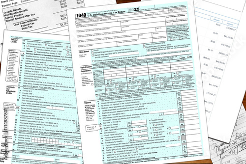 2025 tax year IRS form 1040 and made up financial notes lay on a desktop. 
