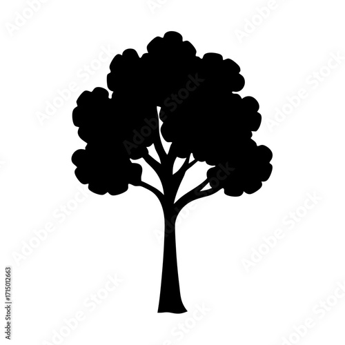 Silhouette of a lush and leafy tree with a strong trunk