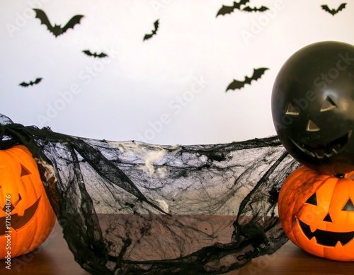 Halloween pumpkins and bats on a table