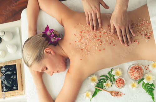 Valokuva Panorama top view woman customer having exfoliation treatment in luxury spa salon with warmth candle light ambient