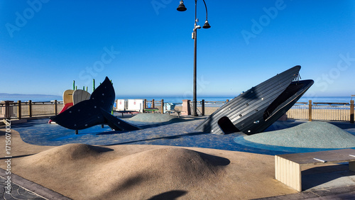 Pismo Beach Looking at the Pier City Plaza and the Playground with a Whale Slide and other underwater themes for kids to play on at the Beach
