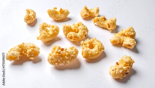 Crispy, cheesy pasta snacks scattered
