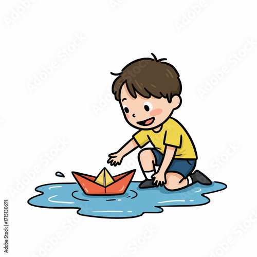 A young boy in a yellow shirt and blue shorts plays with a red paper boat in a puddle of water.