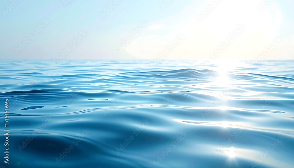 Obraz premium Calm, reflective water under a bright, sunny sky with sunlight glistening off the surface. The horizon line is visible
