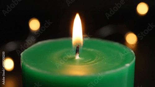 Wallpaper Mural Illuminated candle and soft bokeh: A vibrant, green candle burns with a warm, inviting flame. Gentle bokeh lights dance in the background, creating a soft, ethereal atmosphere. Torontodigital.ca