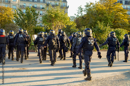 french anti riot police squad and Gendarmerie  marching during a strike