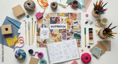 Creative Workspace: Inspiration Board, Sketchbook, and Art Supplies on White Background