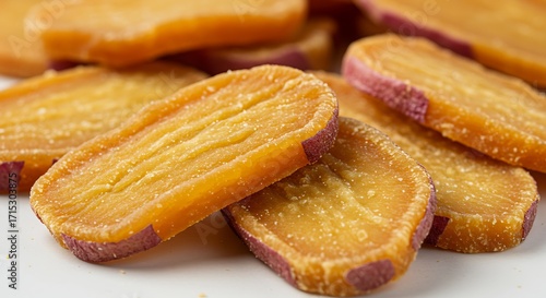 Fototapeta Naklejka Na Ścianę i Meble -  Delectable Sweet Potato Chips - Close-up of Golden-Brown Slices.