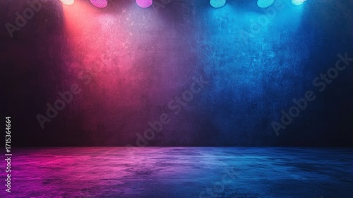A dark, empty stage with neon lights casting a blue and pink glow.