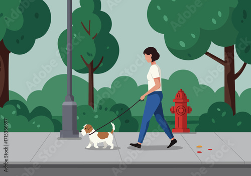 A woman walks her small brown and white dog on a leash along a park sidewalk.