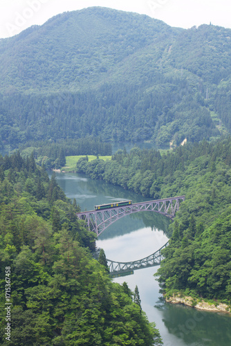 Tadami Line Train Crossing a Scenic Bridge in the Lush Aizu Landscape, Japan