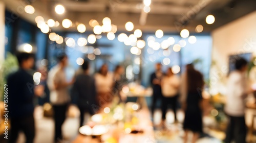 Wallpaper Mural A blurred image of a social gathering or networking event, with people mingling and holding drinks in a modern indoor setting Torontodigital.ca