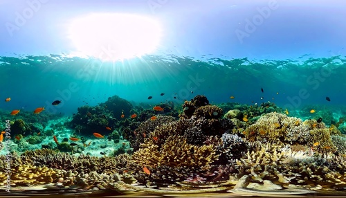 Vibrant coral reef teeming with life, sunlight filtering through the azure water, showcasing biodiversity and marine beauty.