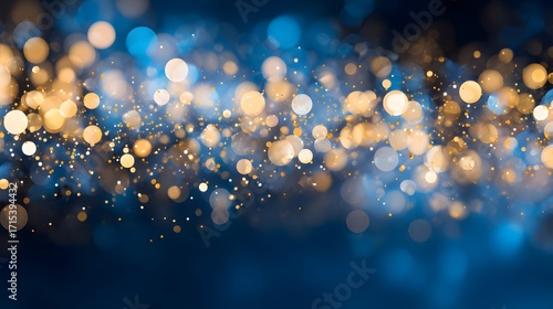 A beautiful abstract background featuring shimmering golden and blue bokeh lights, creating a festive and dreamy atmosphere