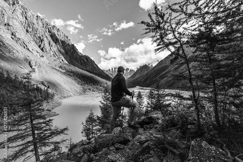 Man hiking in the wild, black and white toned image 