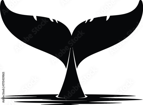 Black whale tail dipping into water silhouette ocean