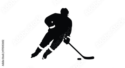 Silhouette of a hockey player in action with puck and stick