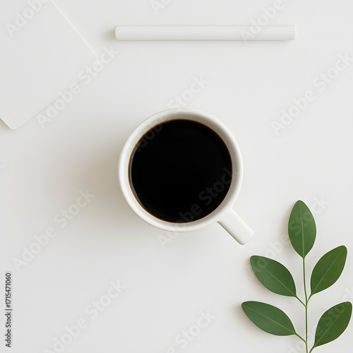 Minimal flat lay composition with cup of black coffee, fresh green leaves, rolled white paper and clean workspace background, perfect for creative design, branding or lifestyle concept