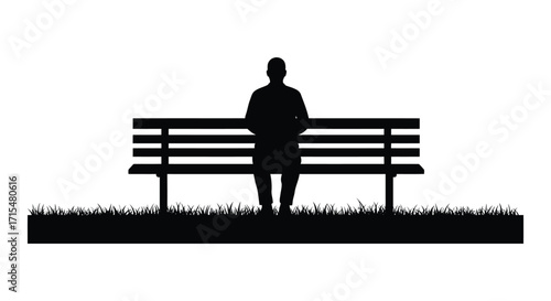 A solitary figure sits thoughtfully on a park bench in silhouette
