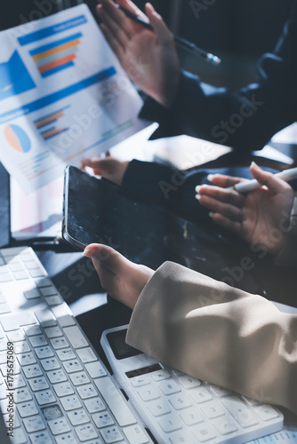 Close up high angle Asian businesswoman working with her coworker in meeting room