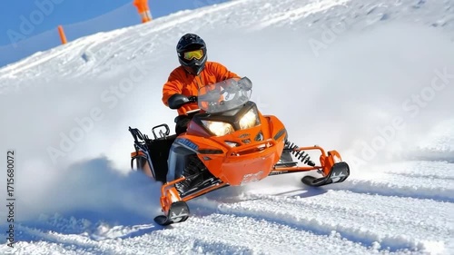 Snowmobiler speeds through fresh powder in a winter sports destination during a sunny day