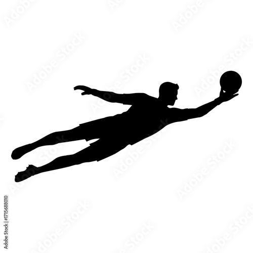 Silhouette of a soccer goalkeeper jumping to catch the ball