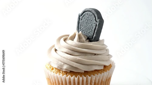 Spooky cupcake with a tombstone decoration, perfect for Halloween celebrations and themed parties.