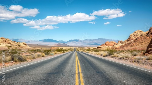 Desert road scenery Arid Serenity: Breathtaking Desert Road Scenery – A Long, Winding Asphalt Road Stretching Through Golden Sand Dunes and Scattered Desert Shrubs, Under a Clear Blue Sky