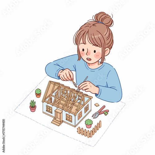 Creative young woman engrossed in building a detailed miniature house model as a hobby