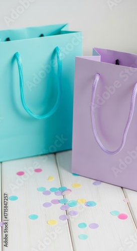 Gift Bags with Confetti on White Wood Surface
