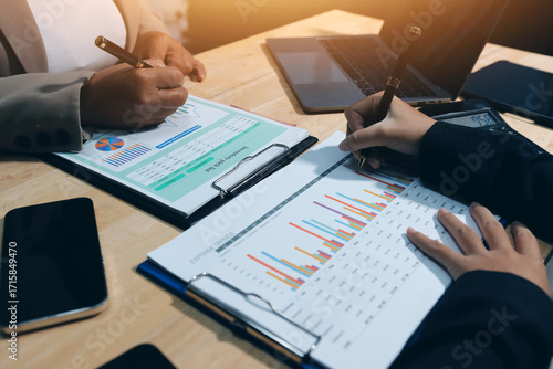 Accounting company provide finance and taxation planning for profitable cash flow, Auditor and accountant team working in office, analyze financial data and accounting record with calculator.Insight