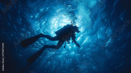 Wallpaper Mural Silhouette of a scuba diver exploring a deep underwater cavern. Torontodigital.ca