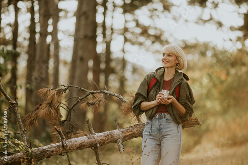 Hiker enjoys a warm drink w...