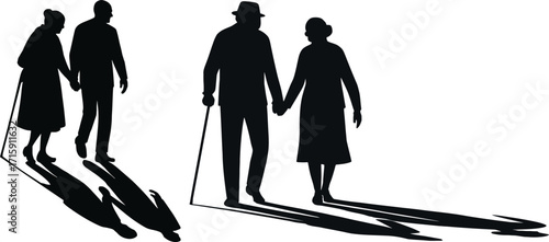 Silhouettes of elderly couples holding hands walking together with canes and long shadows 
