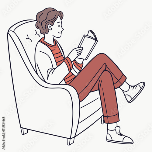 A person comfortably sitting in a plush armchair reading an open book enjoying leisure time