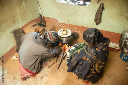 Indian Village Man and Woman in Traditional Rural Kitchen Showing Daily Lifestyle