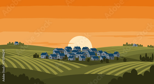 Sunset over rural village with rolling hills and fields