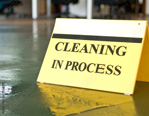 Yellow sign on wet floor