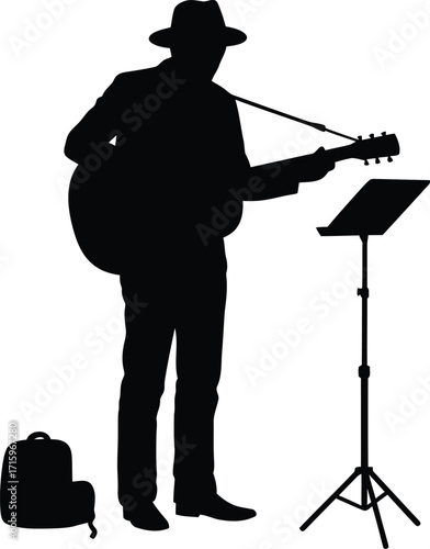 Street performer plays guitar with hat and music stand