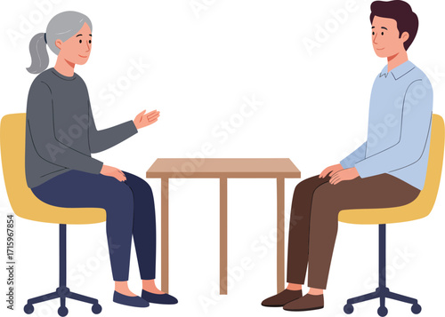 Two people sitting at a table talking