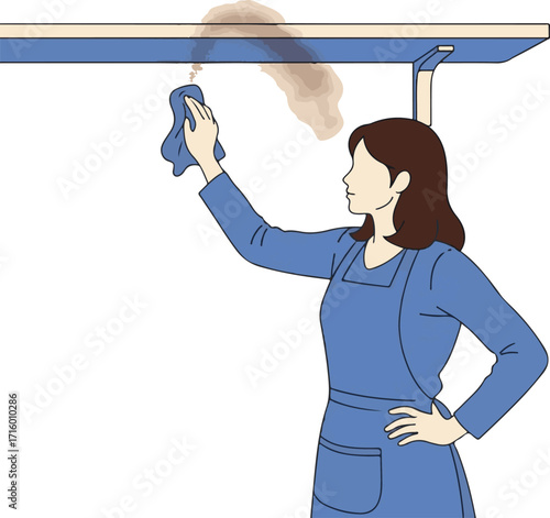 Woman cleaning stubborn smoke or grease stains from an overhead kitchen cabinet.