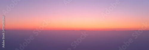 Beautiful blurred sunset sky with soft pastel colors and clouds background
